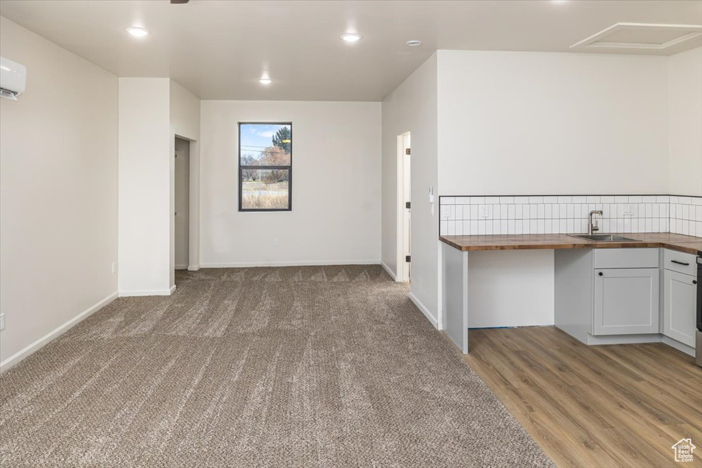 Interior space with an AC wall unit and sink