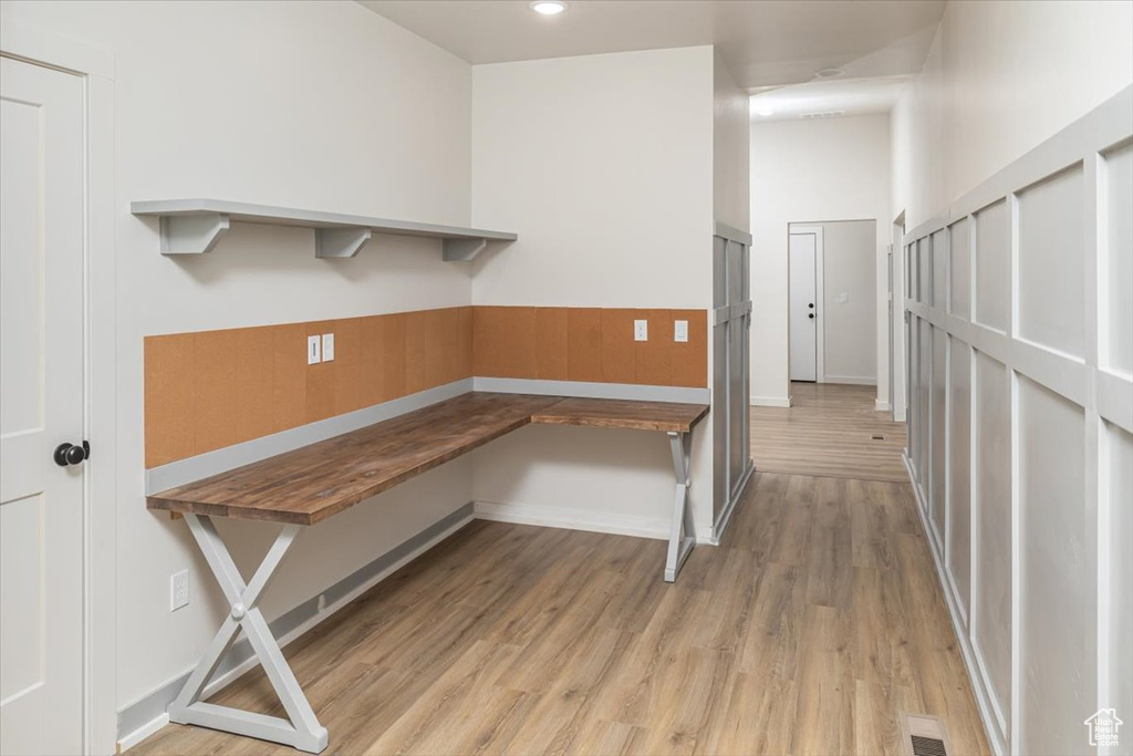 Unfurnished office featuring light hardwood / wood-style floors