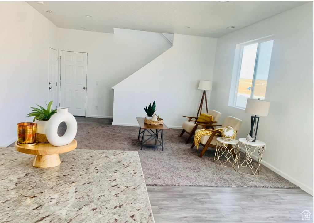 Sitting room with wood-type flooring