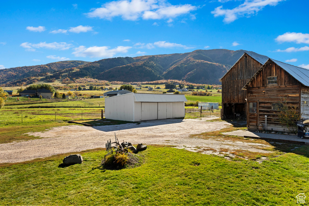 Property view of mountains with a rural view