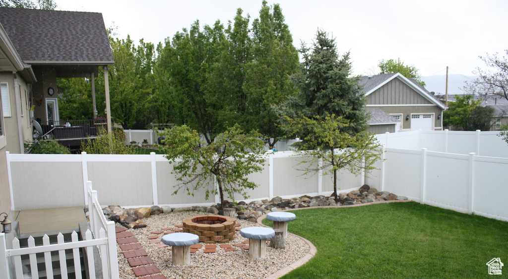 View of yard featuring a fire pit