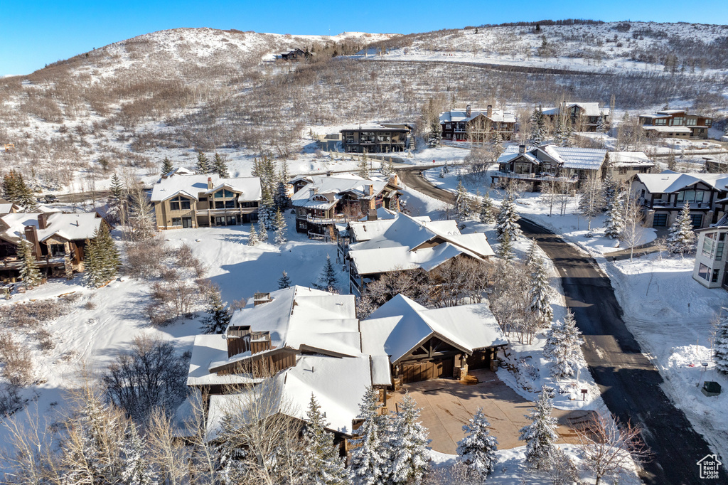 Snowy aerial view featuring a mountain view
