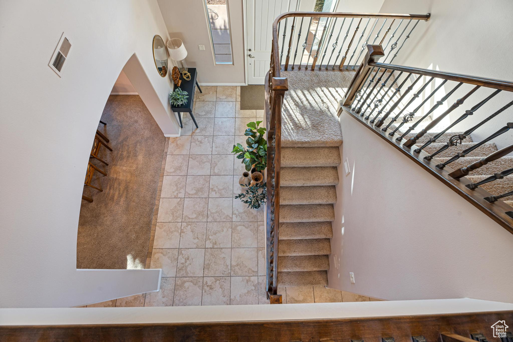 Staircase with tile patterned flooring