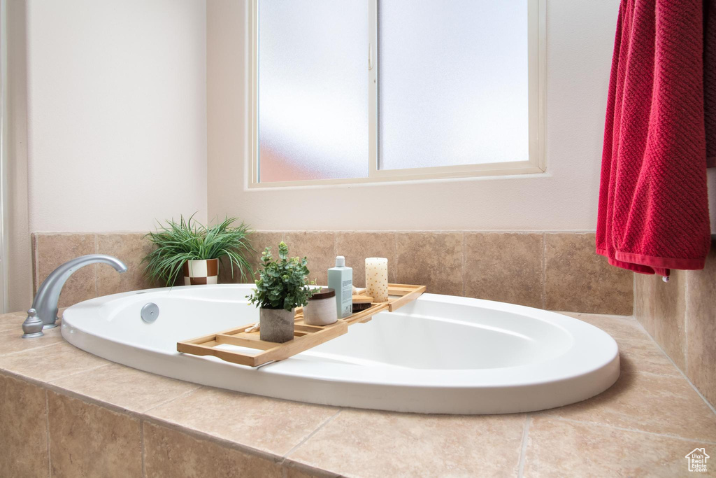 Bathroom featuring tiled bath