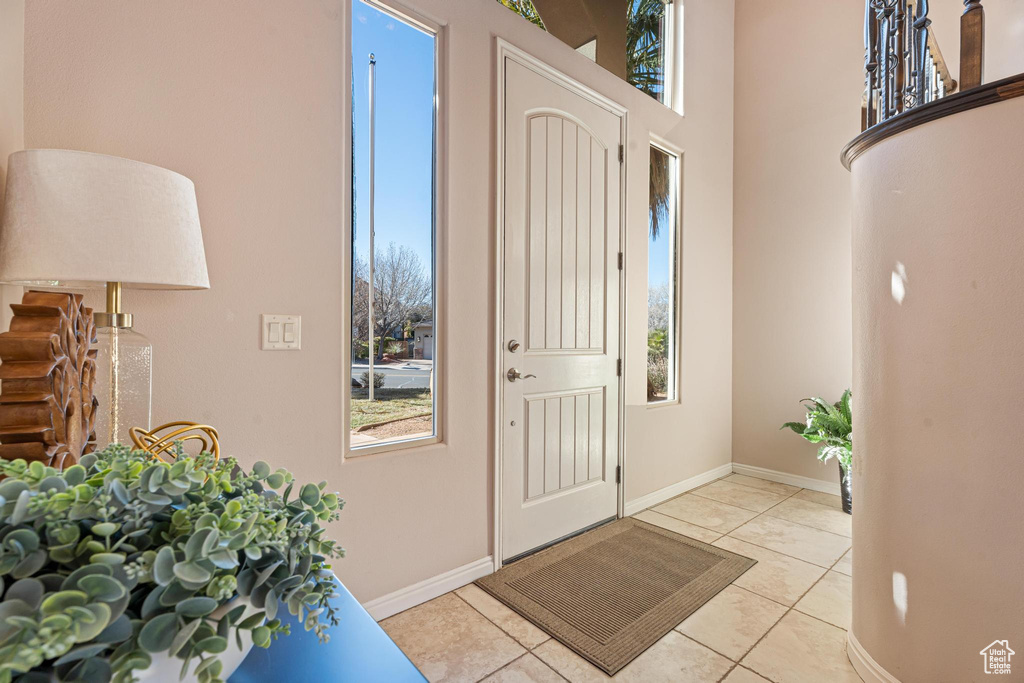Foyer featuring light tile patterned floors