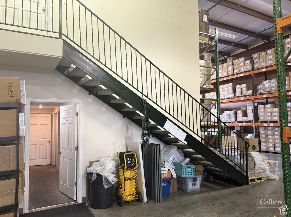 Staircase featuring a towering ceiling