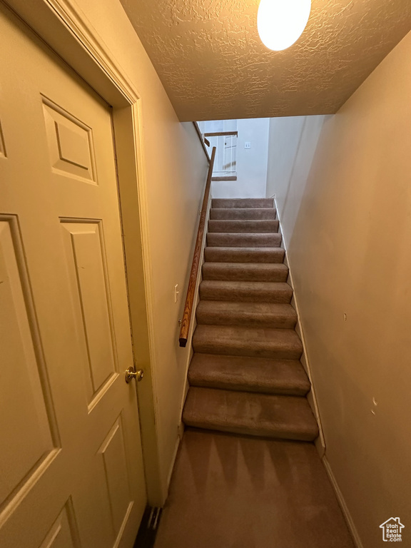 Stairway with a textured ceiling