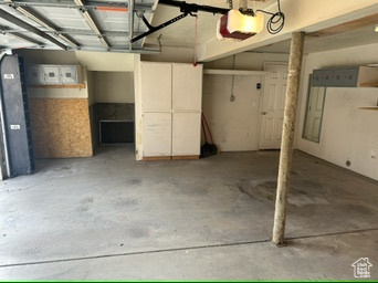 Garage featuring a garage door opener