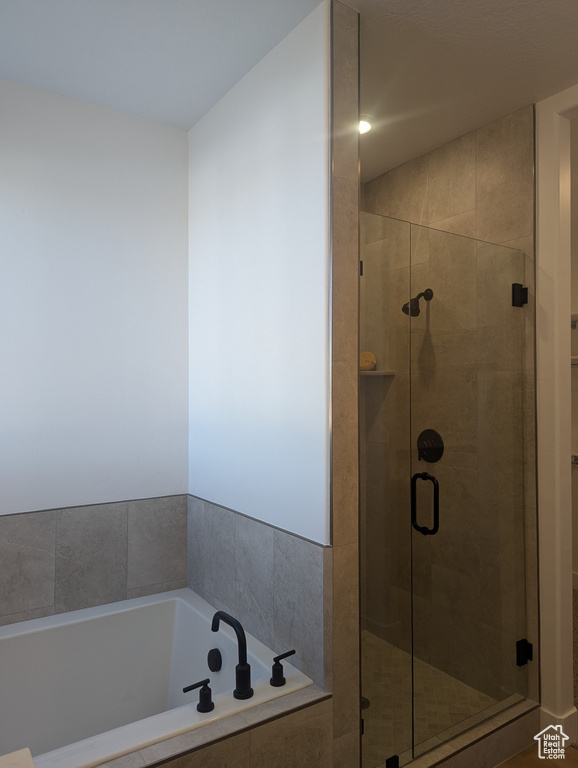 Bathroom with shower with separate bathtub