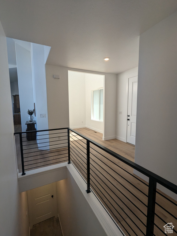 Corridor featuring hardwood / wood-style floors