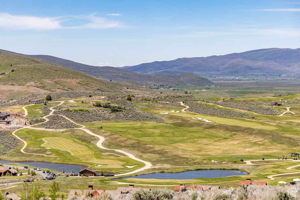 Bird's eye view featuring a water and mountain view and view of golf course