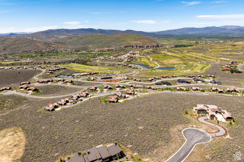 Drone / aerial view with a water and mountain view