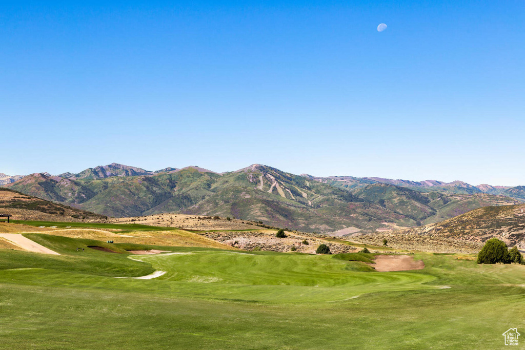 Surrounding community featuring golf course view and a mountain view