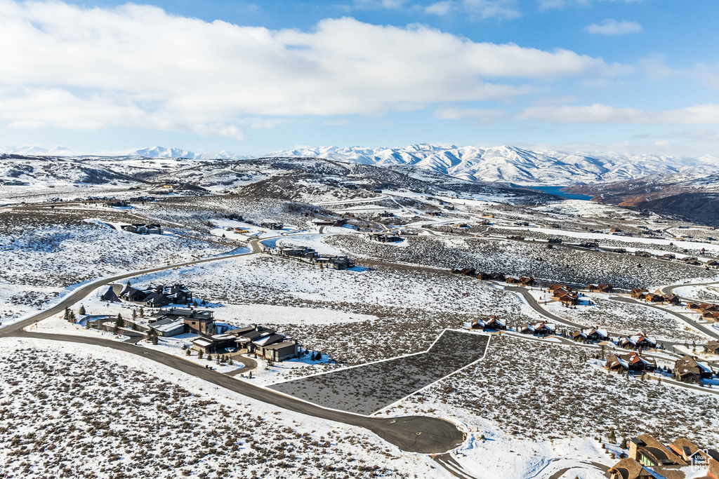 Snowy aerial view featuring a mountain view