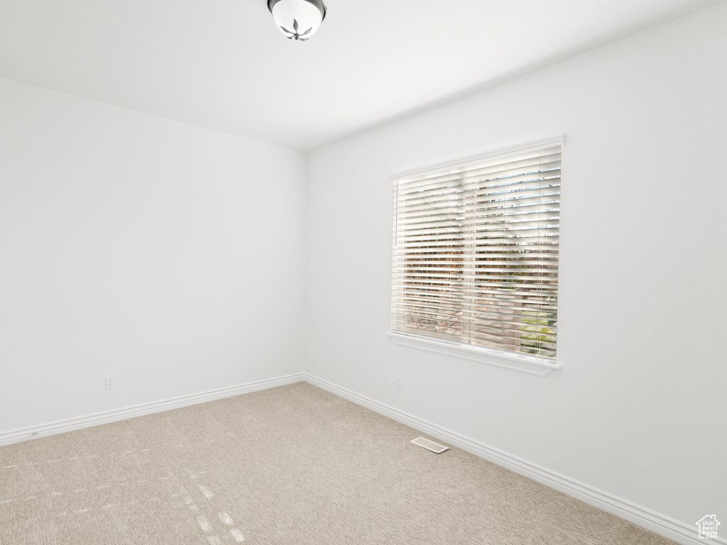 Empty room featuring carpet