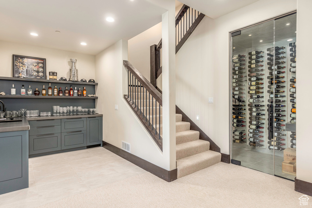 Wine cellar featuring light tile patterned floors