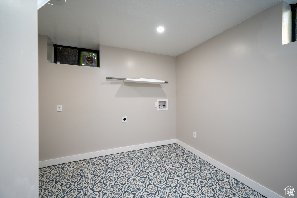 Laundry room with hookup for an electric dryer and hookup for a washing machine