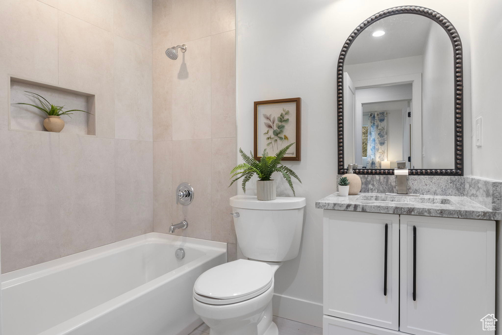 Full bathroom with vanity, toilet, and bathing tub / shower combination