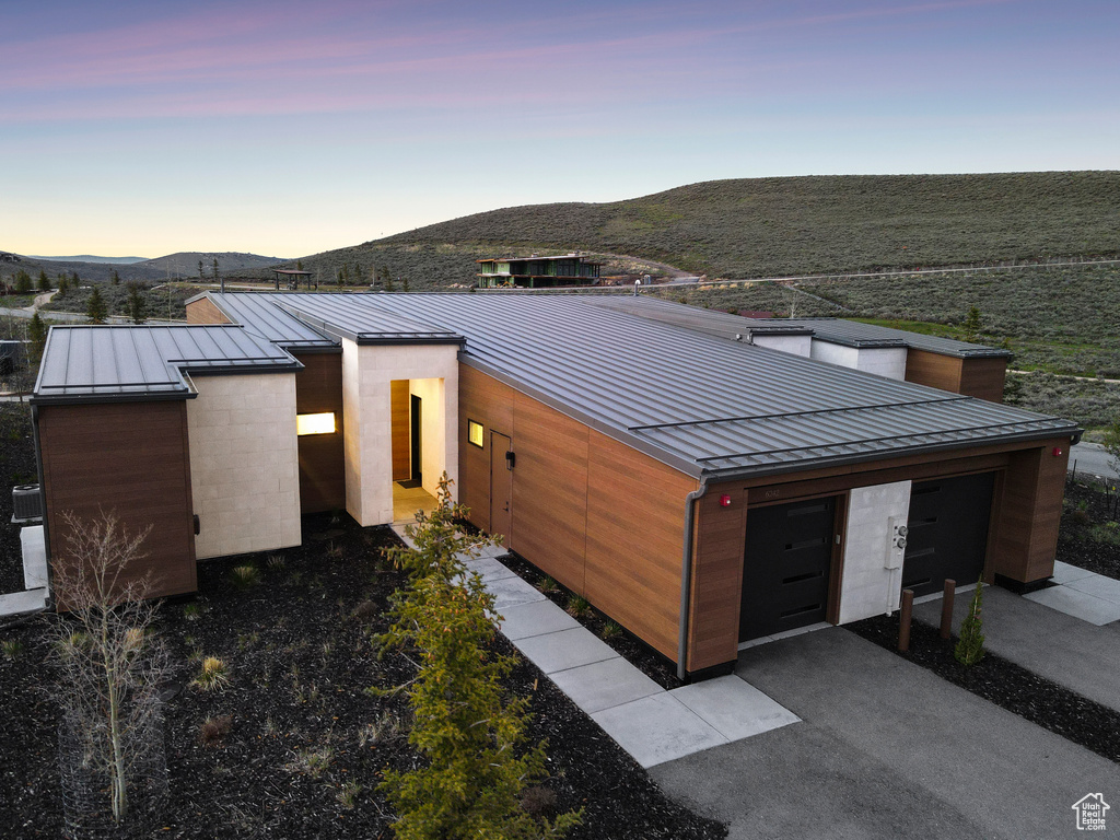 Modern home featuring a standing seam roof, metal roof, and a mountain view