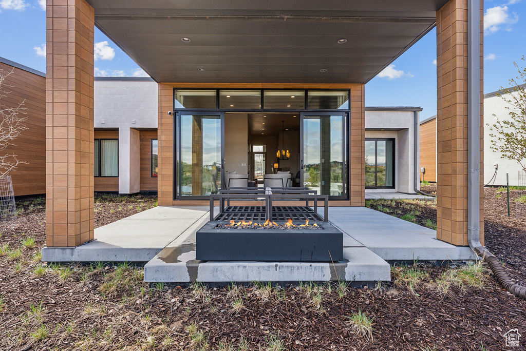 View of patio / terrace with a fire pit