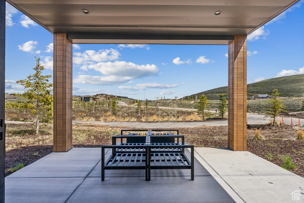 View of patio with a mountain view
