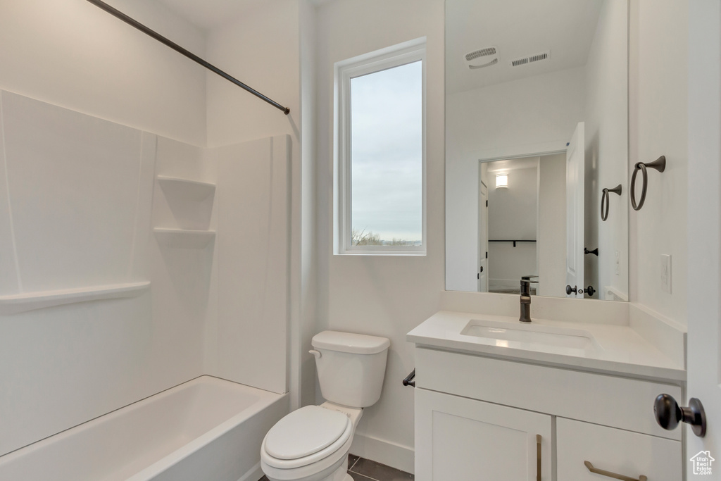 Bathroom featuring vanity, plenty of natural light, and tub / shower combination