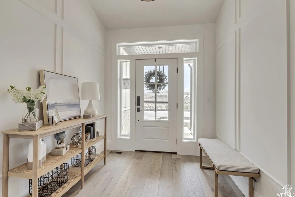 Foyer entrance featuring light hardwood / wood-style flooring