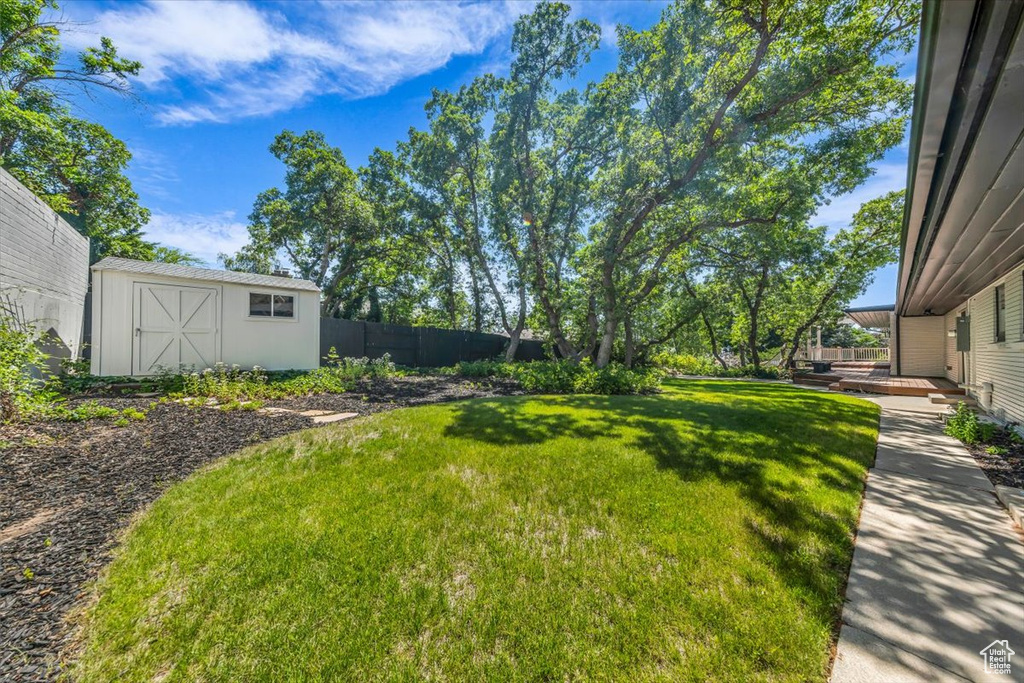 View of yard featuring a storage unit