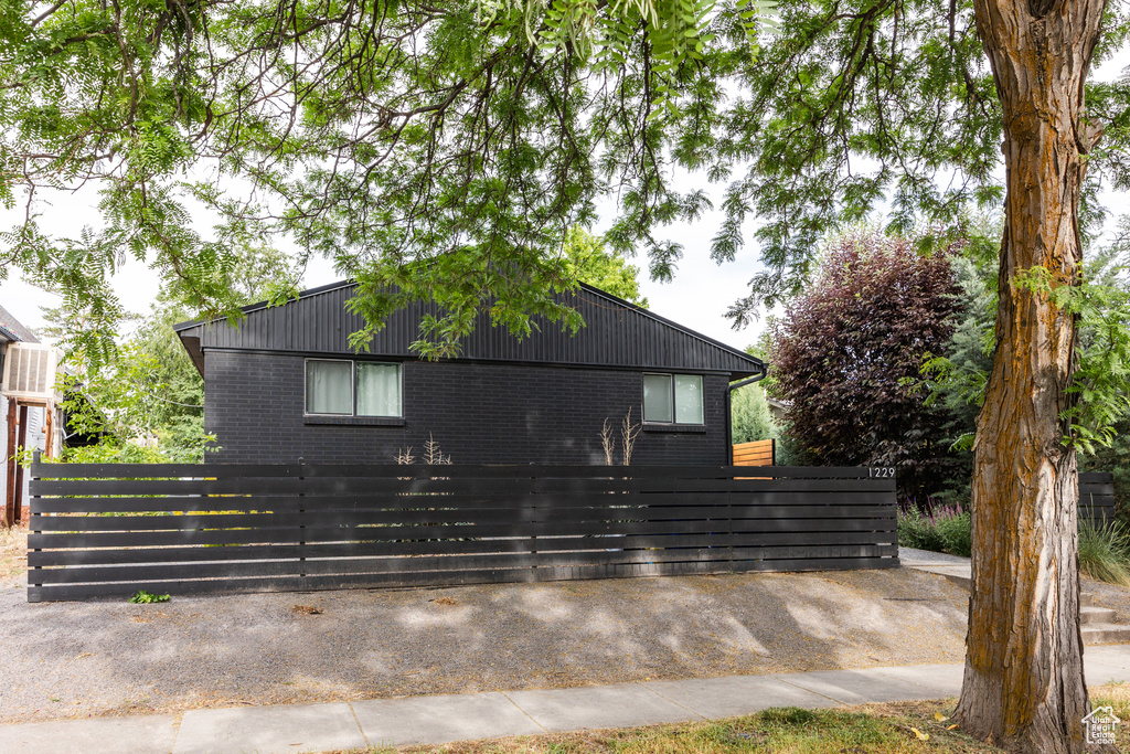View of side of home featuring brick siding