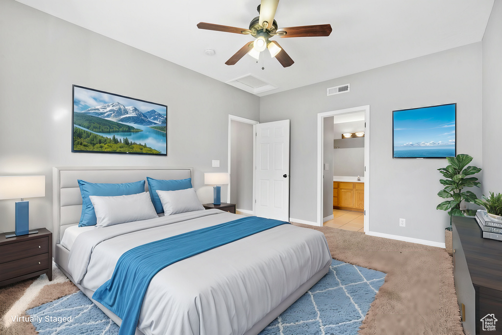 Bedroom featuring light carpet, connected bathroom, and ceiling fan