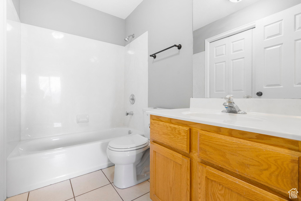 Full bathroom featuring tile patterned floors, shower / washtub combination, vanity, and toilet