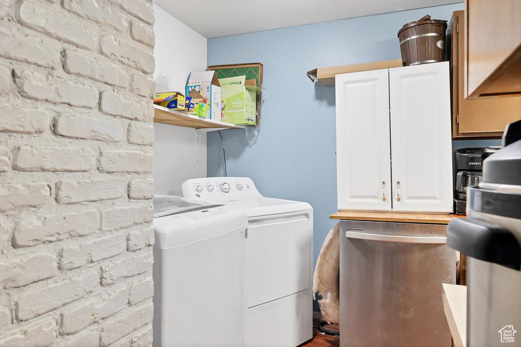 Laundry room featuring washing machine and clothes dryer