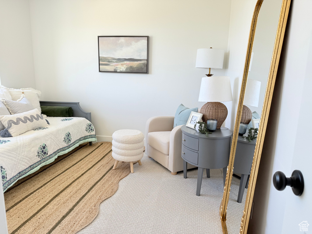 Carpeted bedroom featuring baseboards