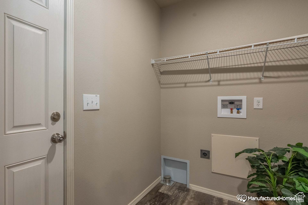 Laundry room with hookup for a washing machine, dark hardwood / wood-style flooring, and hookup for an electric dryer