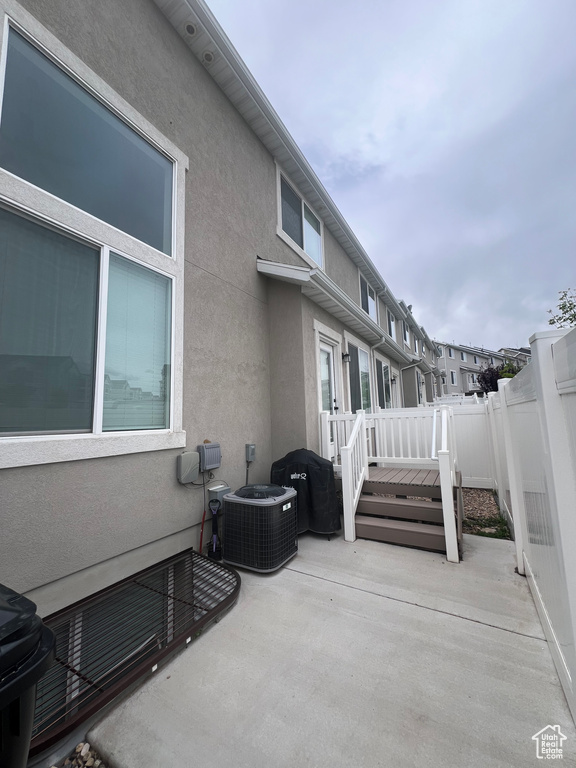 View of patio / terrace with fence and cooling unit
