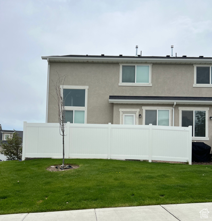 Back of property with stucco siding