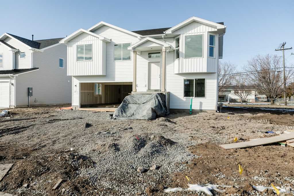 View of front of house featuring board and batten siding