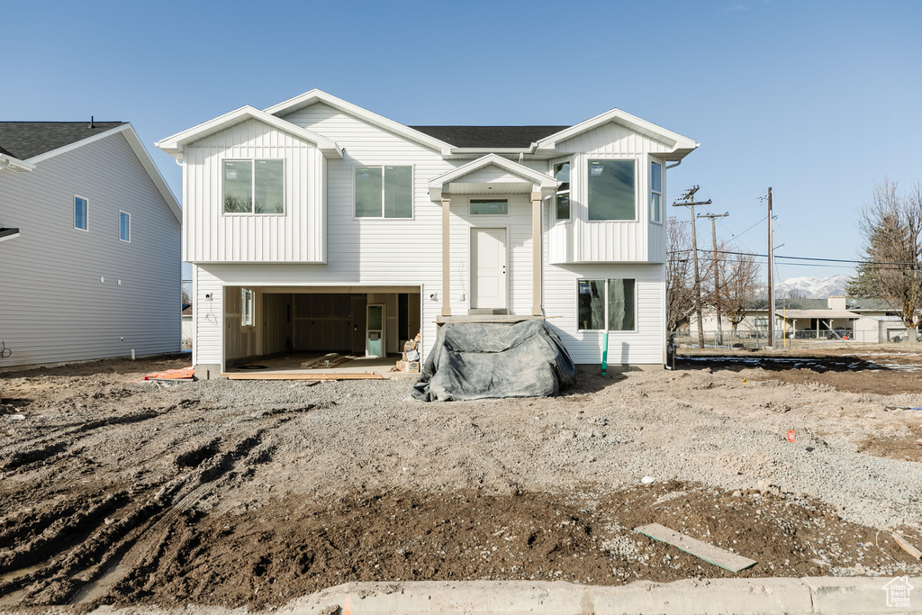 View of front of house featuring a garage and board and batten siding