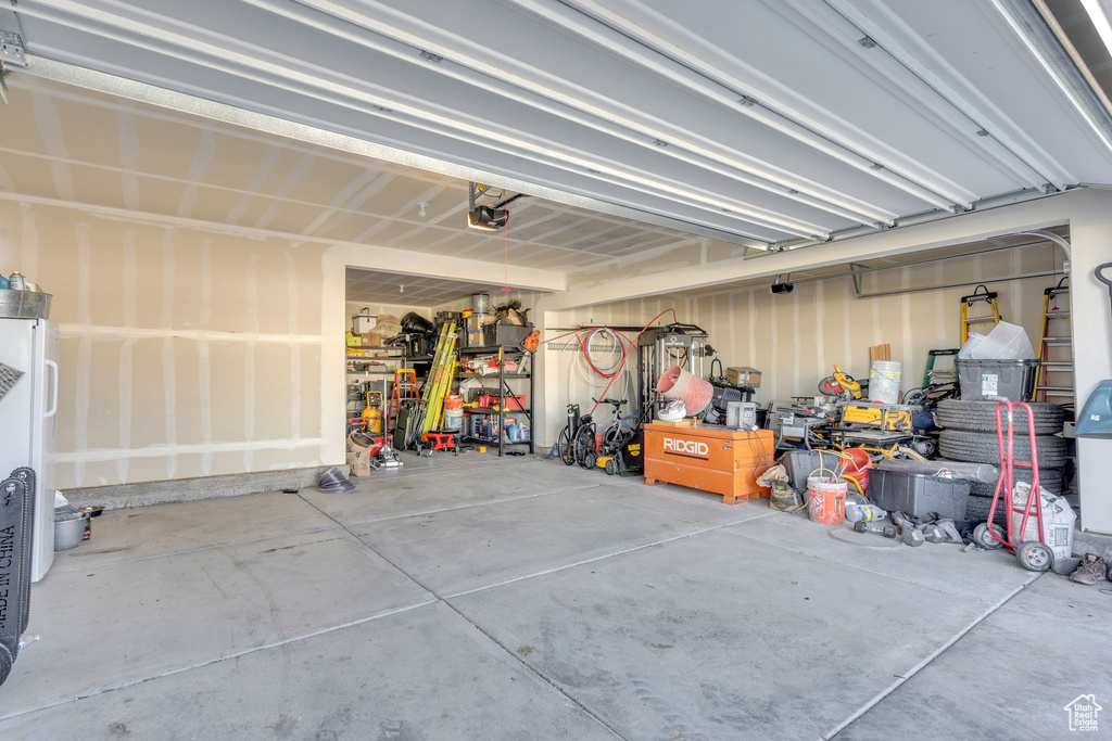Garage featuring a garage door opener