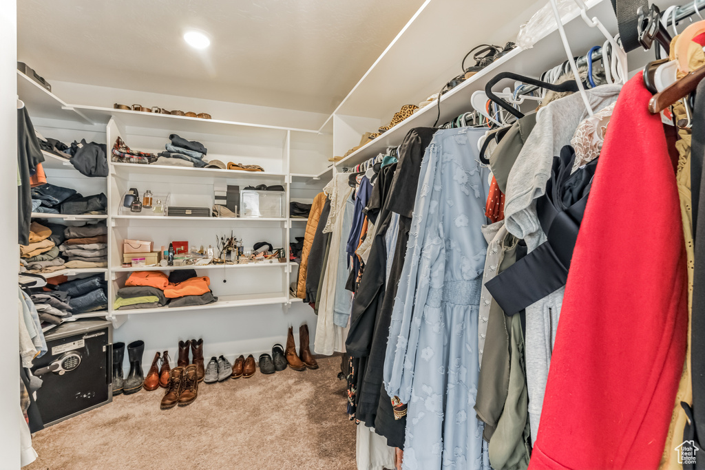 Walk in closet featuring carpet flooring