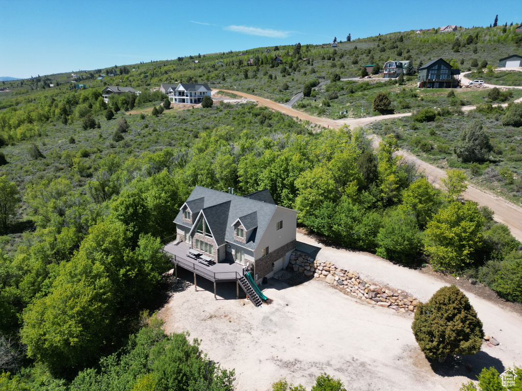 View of subject property featuring a heavily wooded area