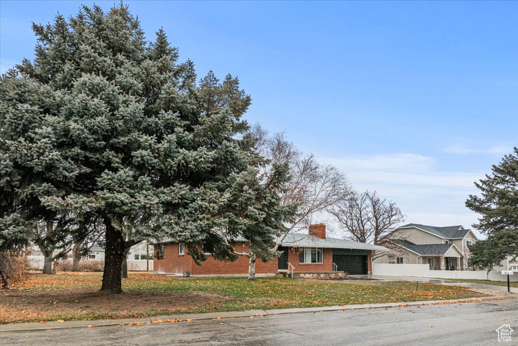 View of front of property featuring a garage
