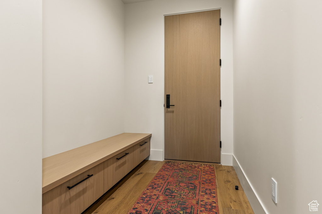 Mudroom with light hardwood / wood-style floors