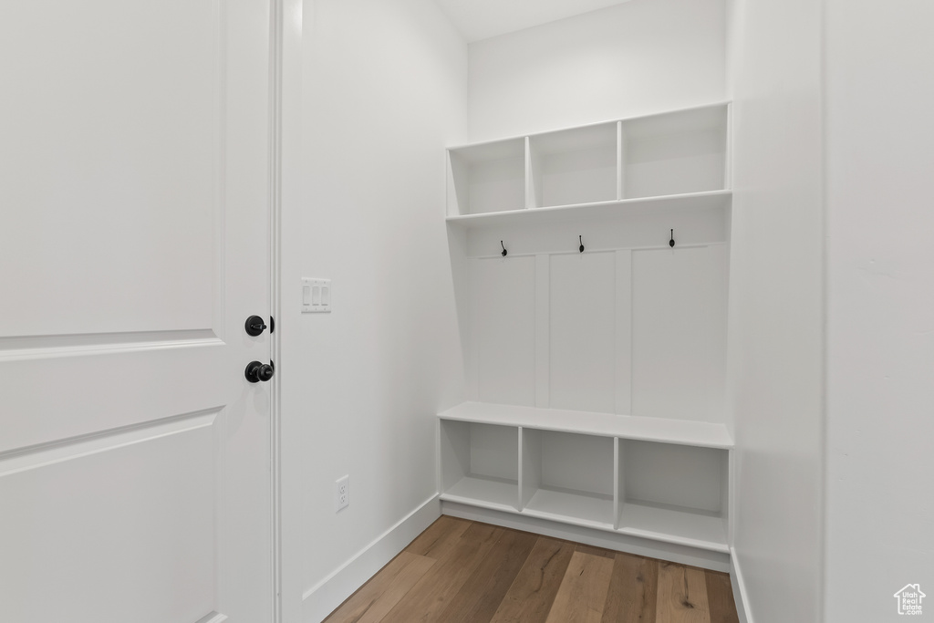 Mudroom with wood-type flooring