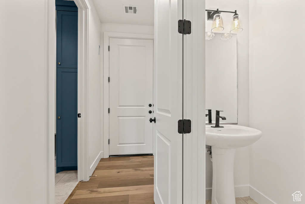 Bathroom featuring hardwood / wood-style floors and sink