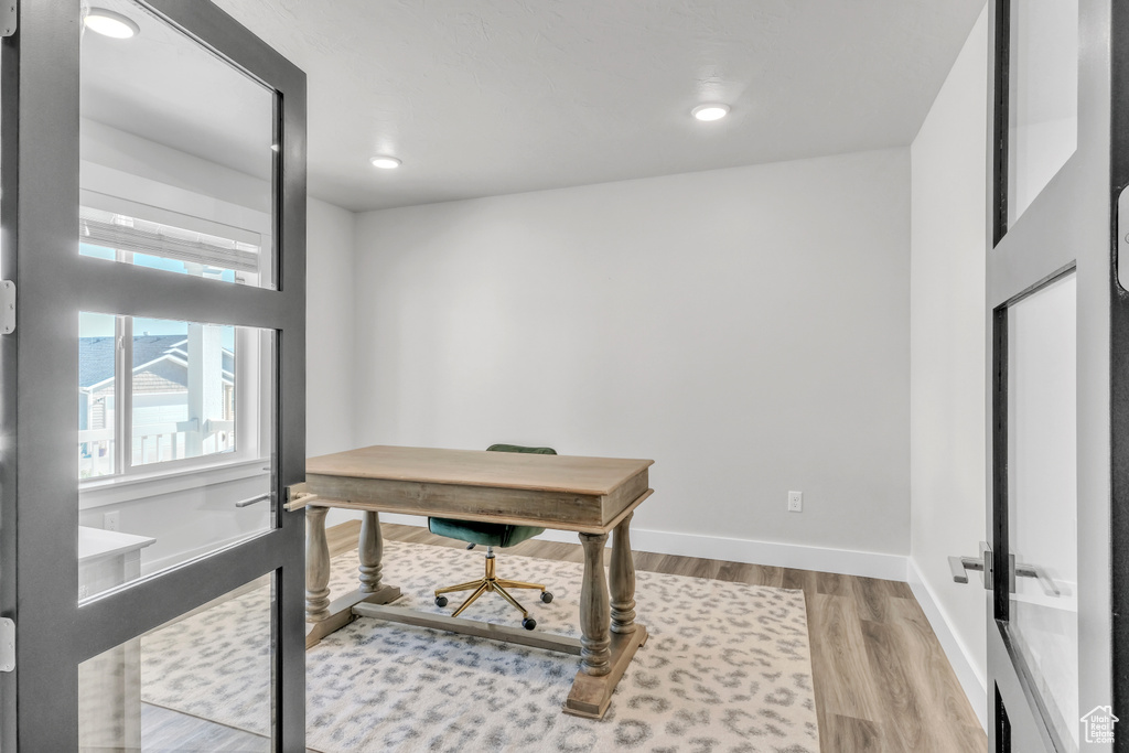 Office area featuring hardwood / wood-style flooring