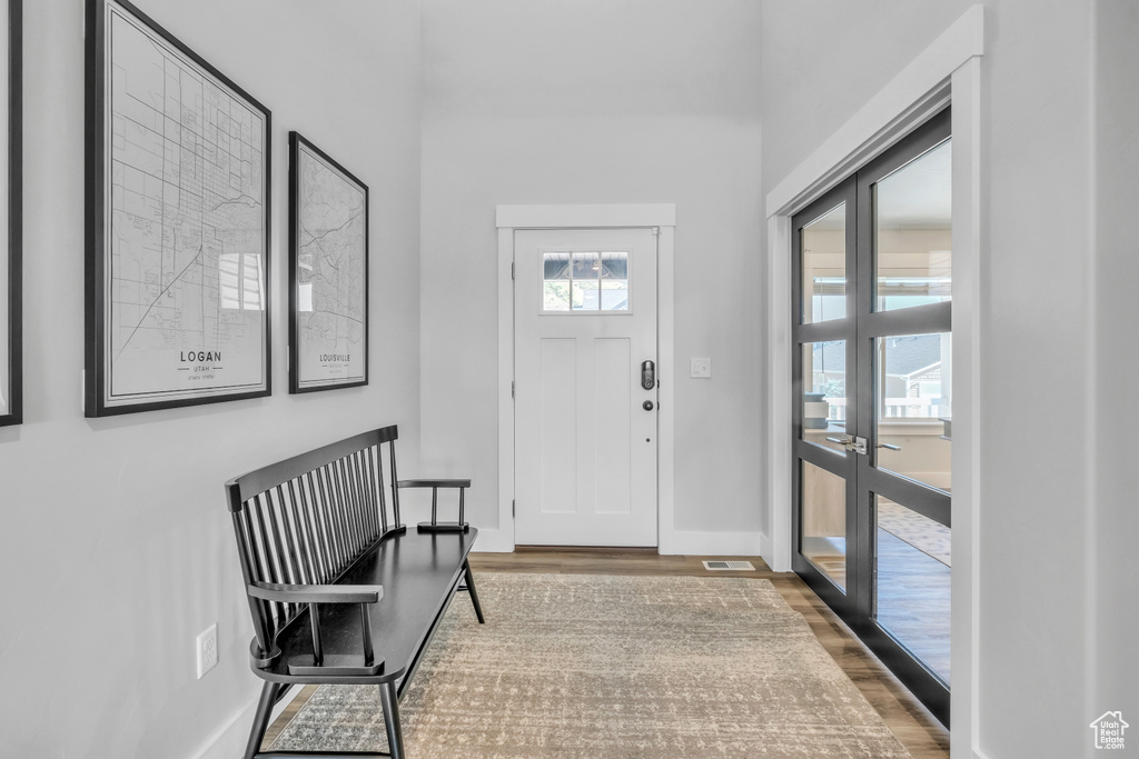 Entryway with hardwood / wood-style floors