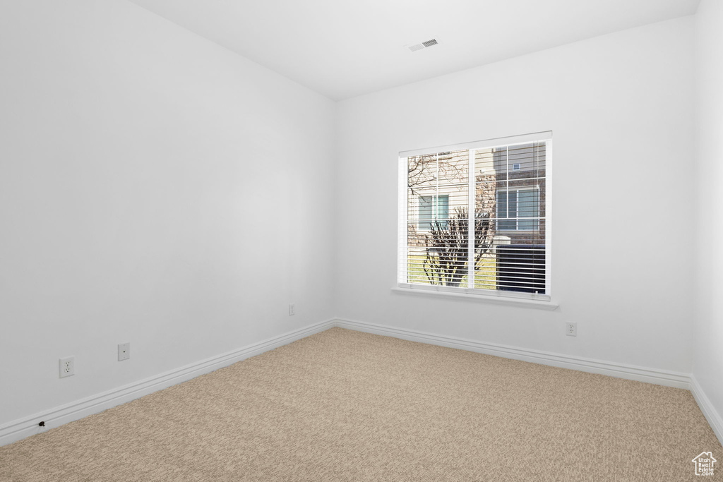 View of carpeted spare room