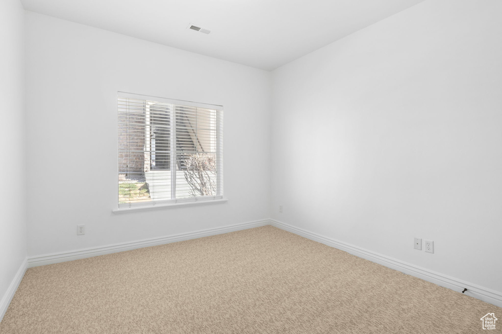 View of carpeted spare room