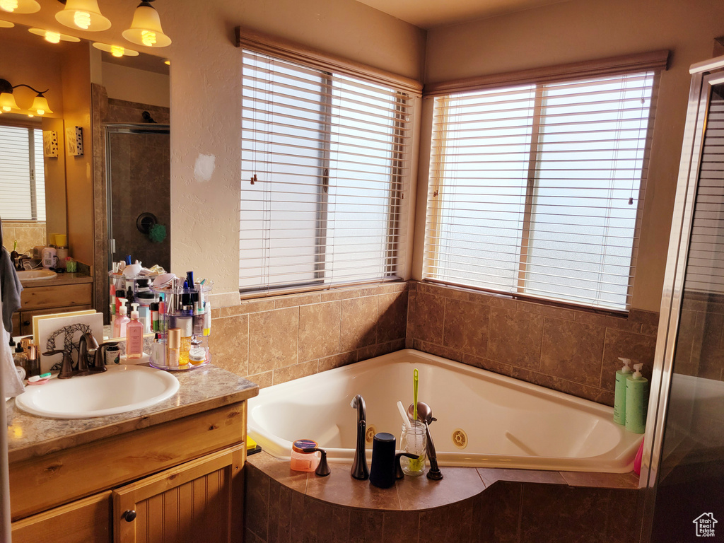 Bathroom with plus walk in shower and vanity